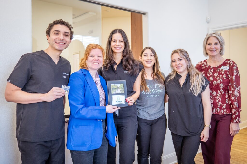 May be an image of 6 people, people smiling, hospital and text