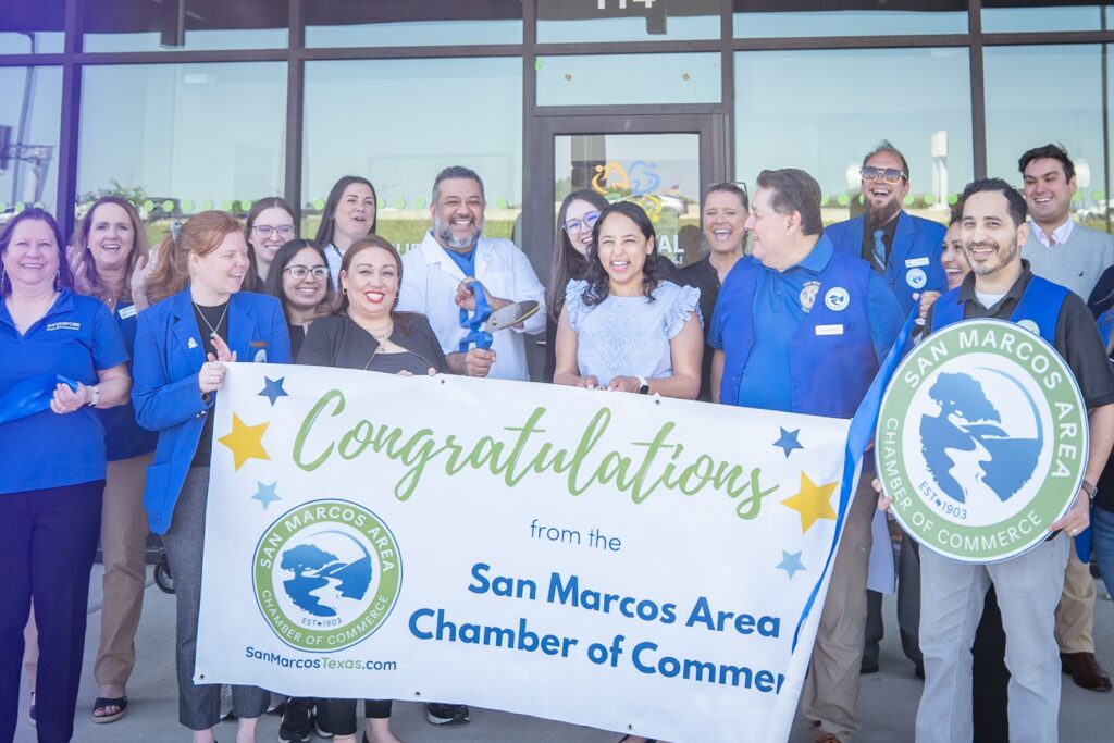 May be an image of 12 people and text that says 'لتفم SAN SAN MARCOS CHAMBER EST EST* 1903 AREA OF COMMERCE 903 MARCOS Congratulation SAN ΟΑΚ ልድት from the San Marcos Area EST+190 EOUMECE OF SanMarcosTexas.com Chamber of Comme,'