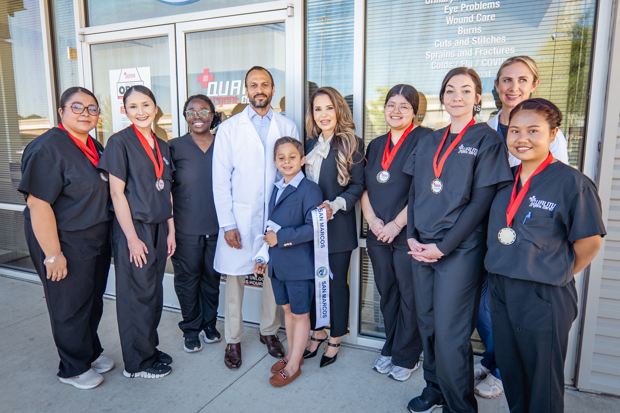 May be an image of 9 people, people smiling, hospital and text