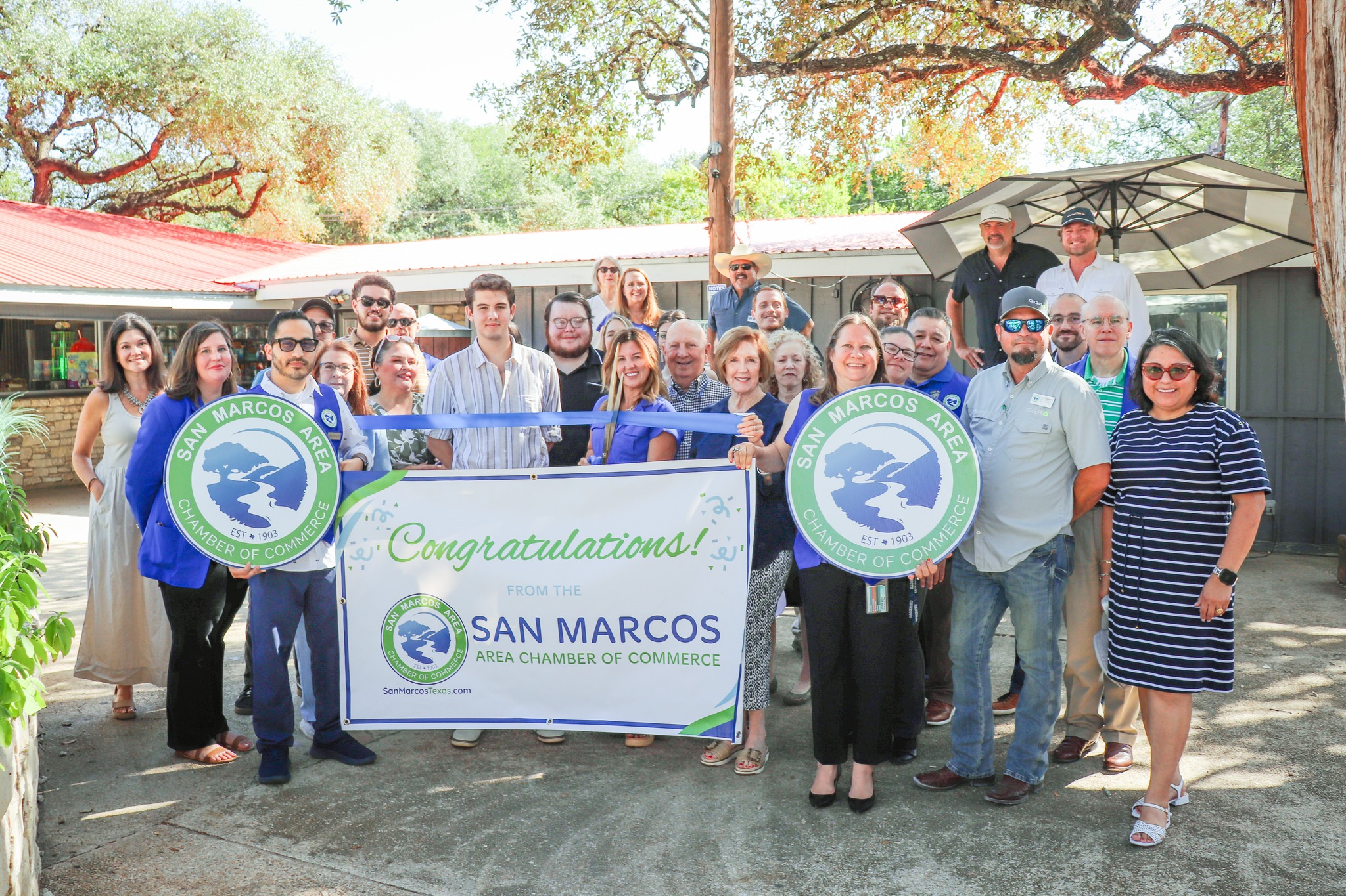 May be an image of 10 people and text that says 'MARCOS AREA B SAN CHAMBE EST ESTA1503 COM MARCOS E AREA SAN EST EST 190% OF Congratulations! بق FROMTHE THE SAN MARCOS AREA CHAMBER OF COMMERCE SarHarcanTerea.cum JUIT'